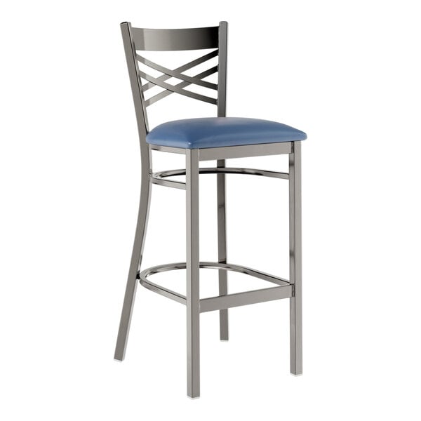 A Lancaster Table & Seating metal bar stool with a navy blue padded seat.