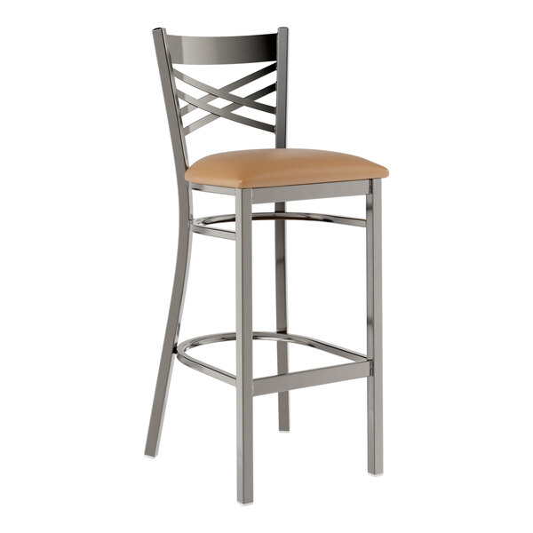 A metal bar stool with a cross back design and a light brown vinyl padded seat.