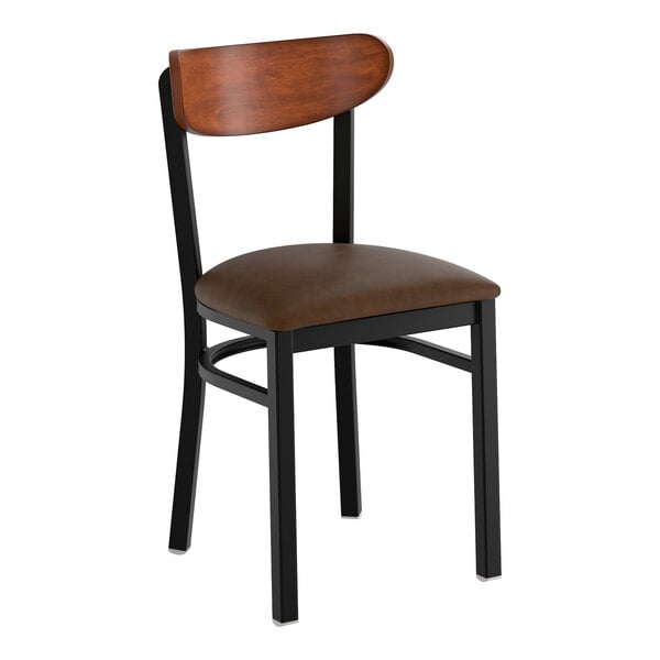 A black metal chair with a dark brown vinyl seat and an antique walnut wood backrest.