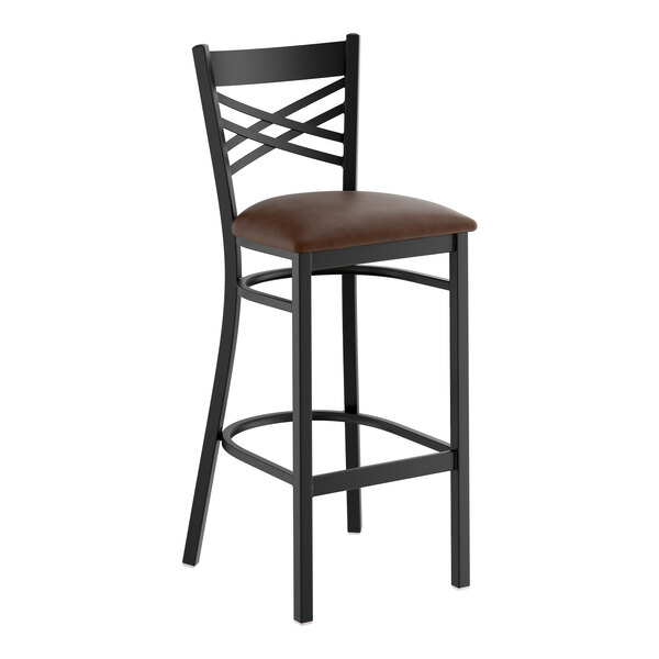 A black metal bar stool with a cross back design and a dark brown vinyl padded seat.