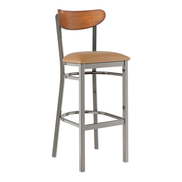 A Lancaster Table & Seating bar stool with a brown cushioned seat and wood back.