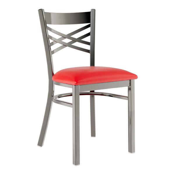 A Lancaster Table & Seating clear coat metal cross back restaurant chair with a red vinyl padded seat.