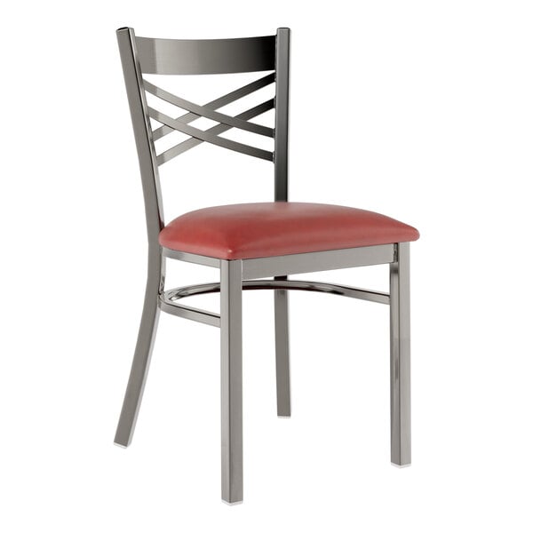 A Lancaster Table & Seating metal cross back chair with a burgundy vinyl padded seat on a white background.