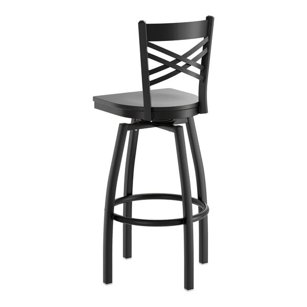 A black swivel bar stool with a cross back design and a black wood seat.
