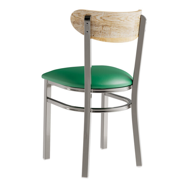 A Lancaster Table & Seating chair with a green vinyl seat and driftwood back.