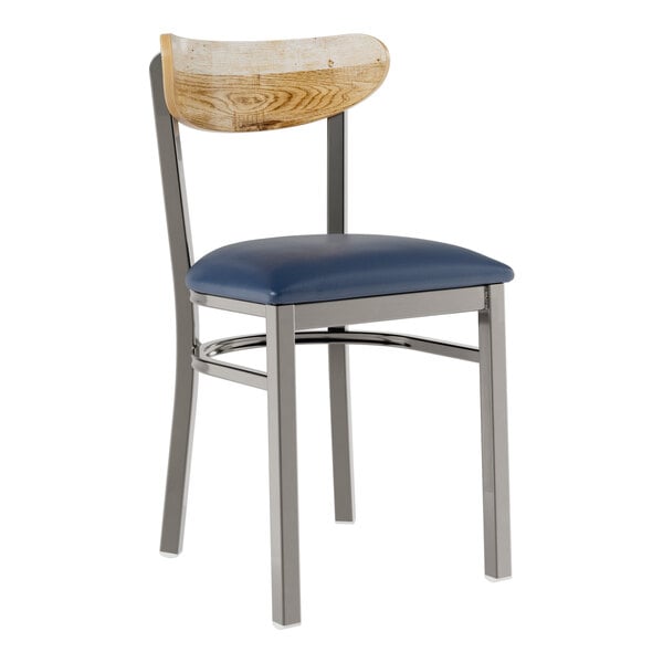 A Lancaster Table & Seating metal chair with a blue vinyl seat and driftwood back.