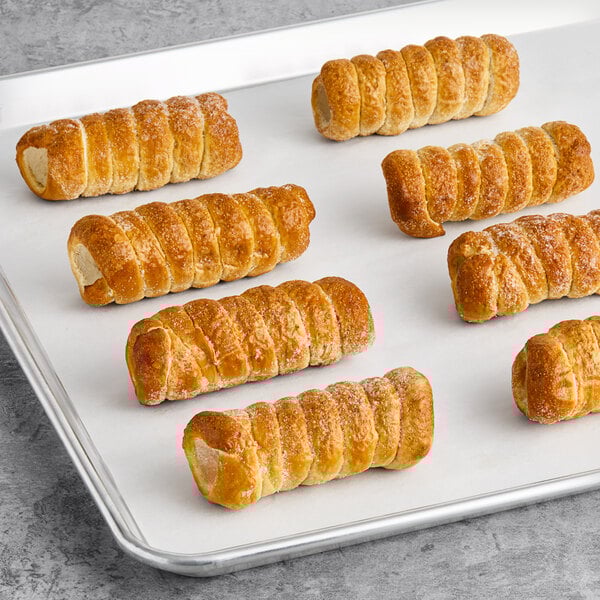A tray of Pennsylvania Dutch soft pretzel shells on a white surface.
