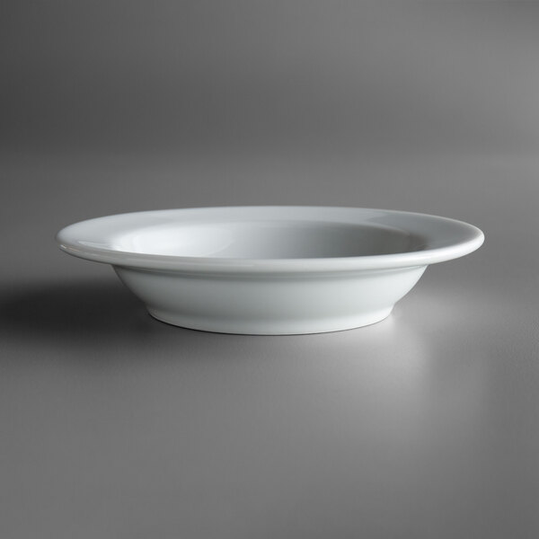 A close up of a Oneida Royale bright white porcelain fruit bowl.