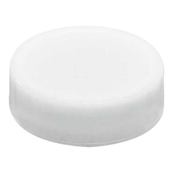 A white, round, plastic cap with a smooth surface and slightly raised edges.
