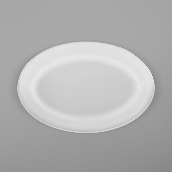 A white Oneida Royale porcelain oval platter on a gray surface.