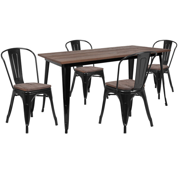 A Flash Furniture black rustic wood and galvanized steel table with four chairs.