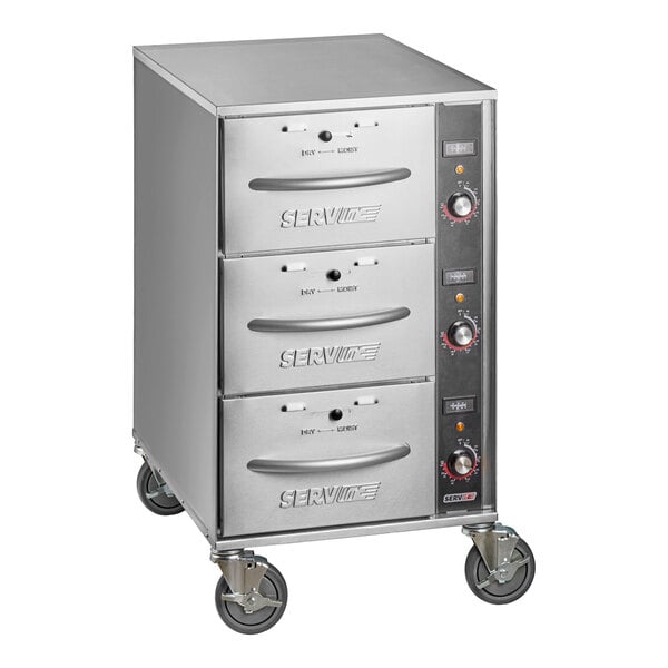 A stainless steel mobile triple narrow freestanding drawer warmer with three drawers and control knobs on the side.