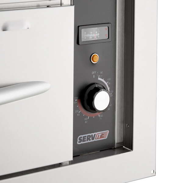 A close-up of a ServIt double built-in drawer warmer.