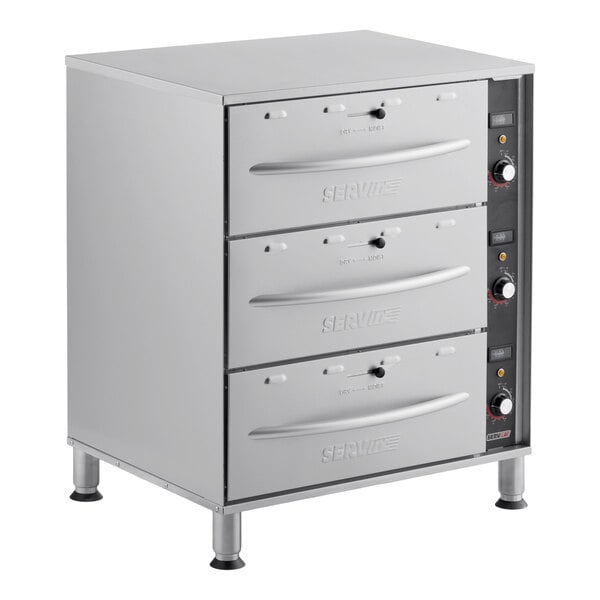 A triple freestanding stainless steel drawer warmer with three pull-out drawers and control knobs on the right side.