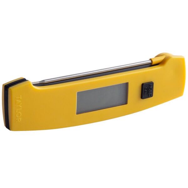 A yellow Taylor digital thermometer with a screen and rectangular window.