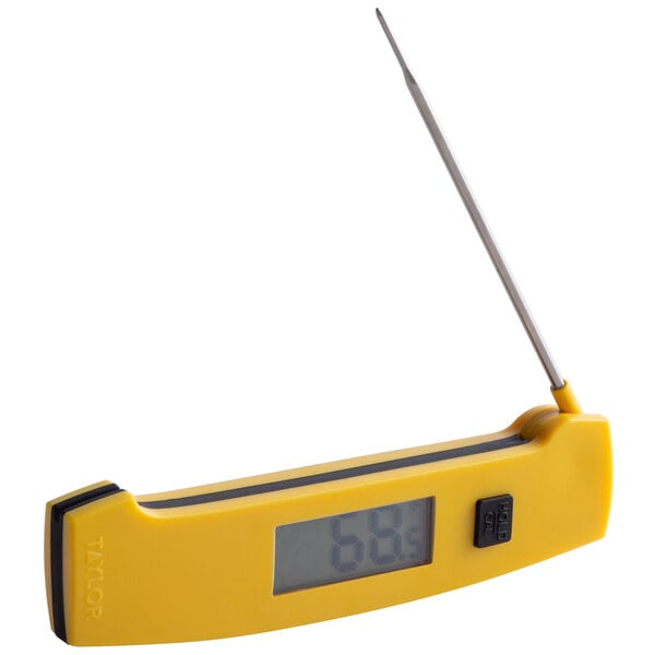 A Taylor yellow digital folding thermometer with a long needle.