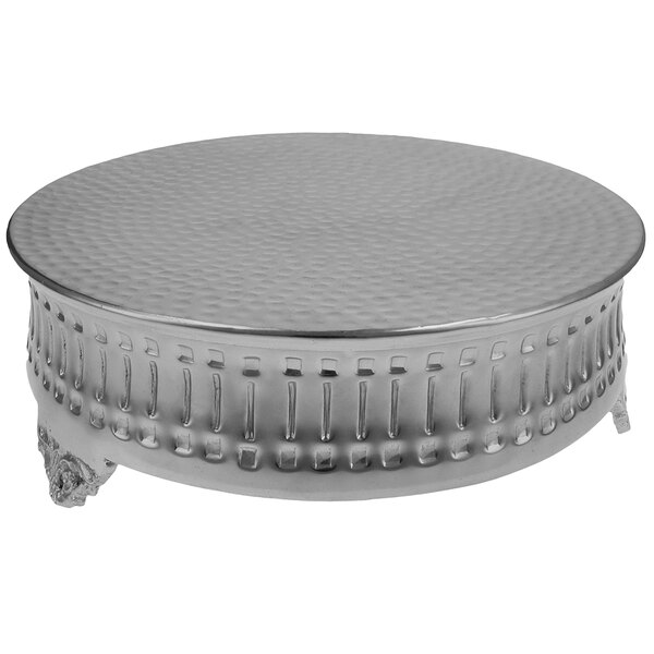 A Tabletop Classics by Walco nickel-plated round cake stand with a decorative design on the surface.