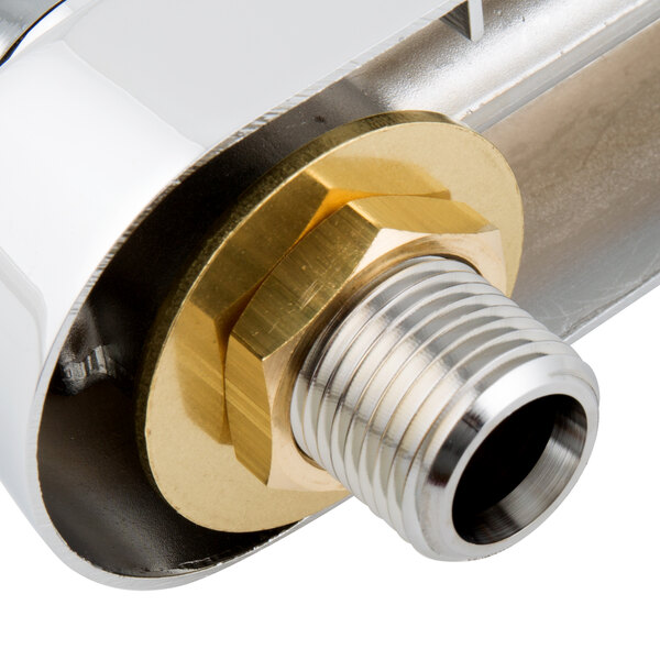 A close up of a brass and chrome T&S workboard faucet base.