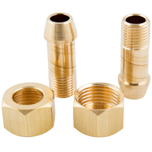 A close-up of three brass threaded nuts on a T&S brass deck mounted faucet base.