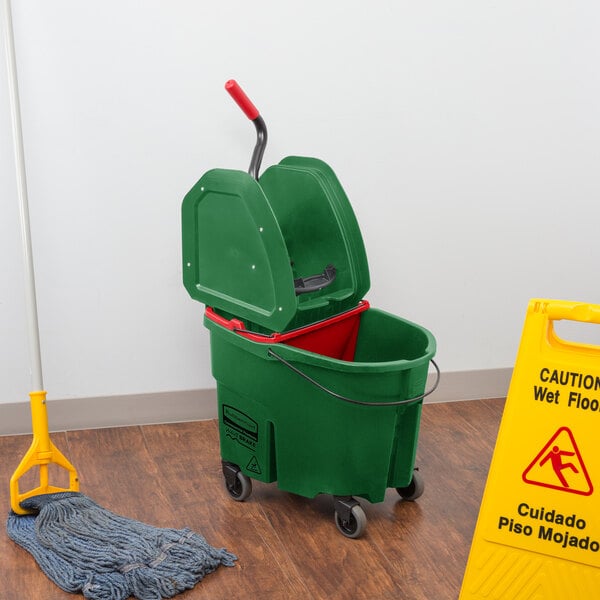 a green bucket with a red lid