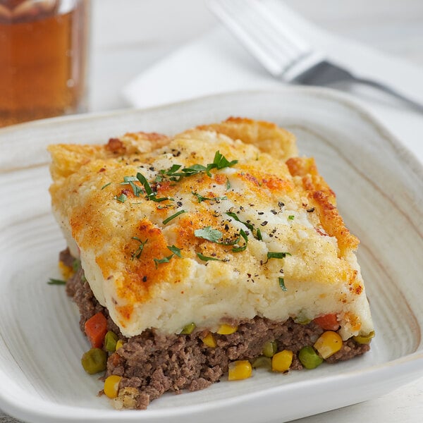 slice of shepherds pie on a white plate