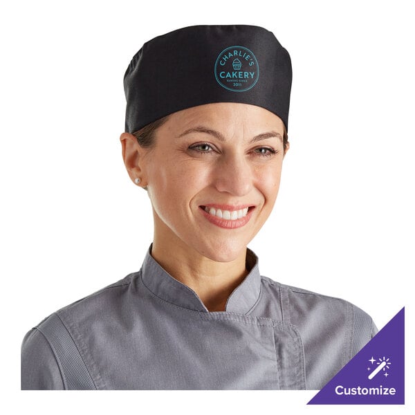A woman wearing a large black Choice cloth chef's hat with a customizable cloth top.