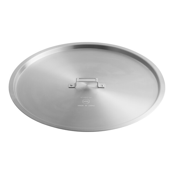 A large round aluminum pot or pan cover with a flat handle in the center.