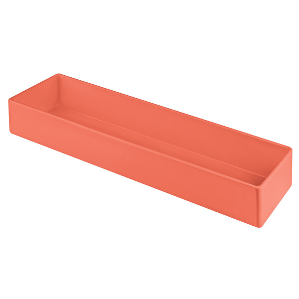 A rectangular orange cast aluminum bowl on a counter in a salad bar.