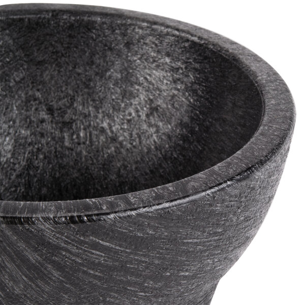 A black polypropylene Molcajete bowl with a handle.