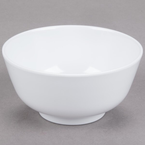 A white GET Water Lily melamine bowl on a gray surface.