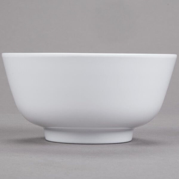 A close-up of a white GET Water Lily melamine bowl.