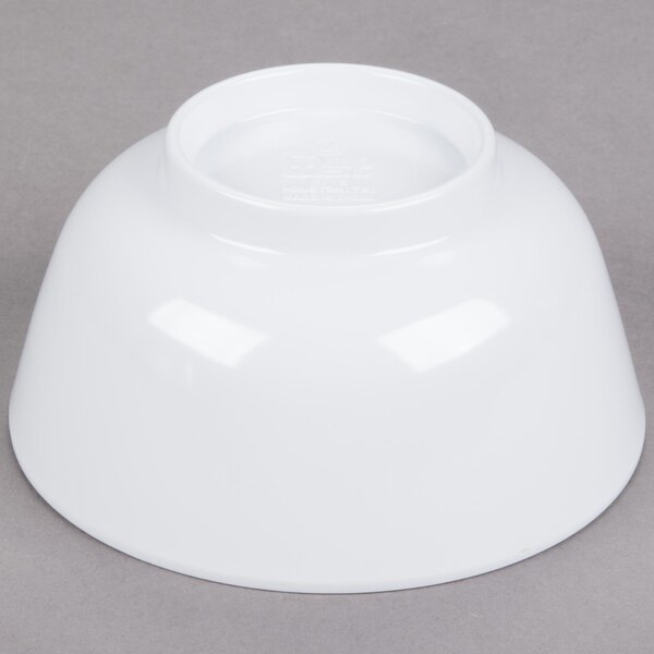 A white GET Water Lily melamine bowl on a gray surface.