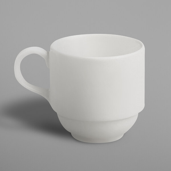 A white RAK Porcelain stackable cup with a white handle.