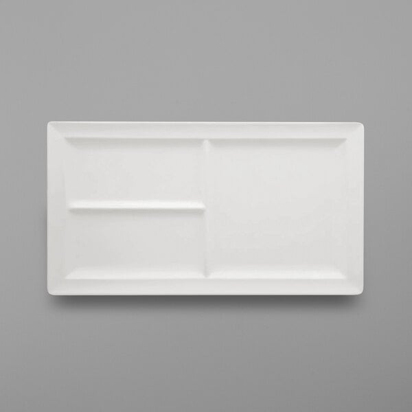 a white rectangular plate with three compartments