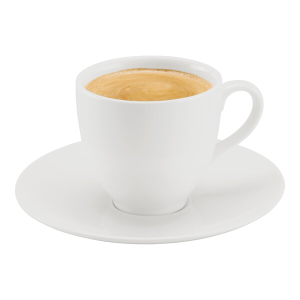 A white porcelain cup filled with coffee, placed on a matching saucer.