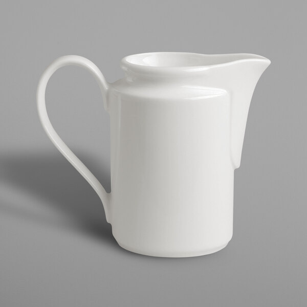 A RAK Porcelain ivory porcelain creamer with a handle.