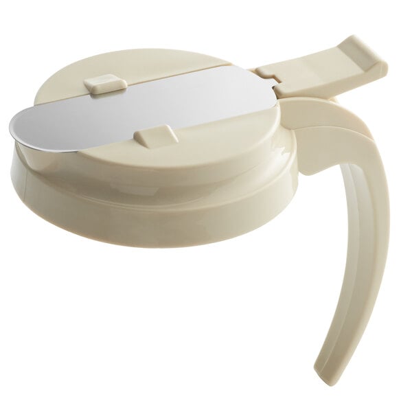 An almond plastic lid for syrup servers with a metal handle.
