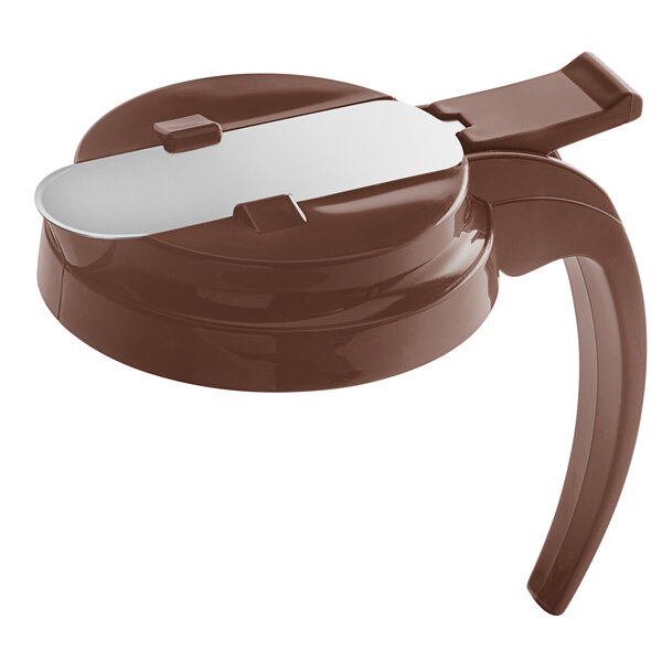 A brown plastic lid for a syrup server.