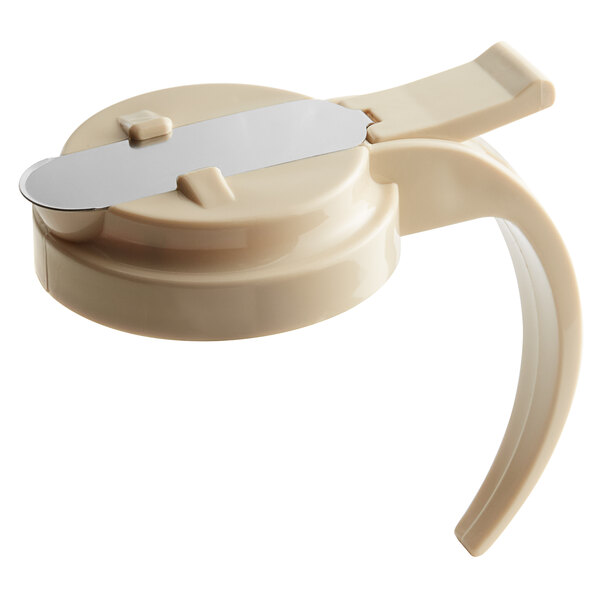 An almond plastic lid for Vollrath syrup servers.
