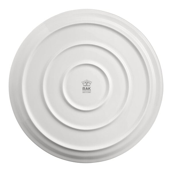 A white RAK Porcelain pizza plate with circular designs.