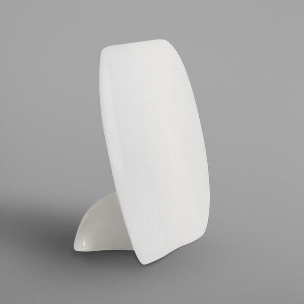 A close up of a white RAK Porcelain menu holder.