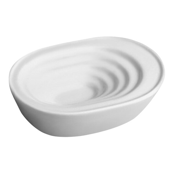 An ivory porcelain olive dish with a smooth, rounded design.