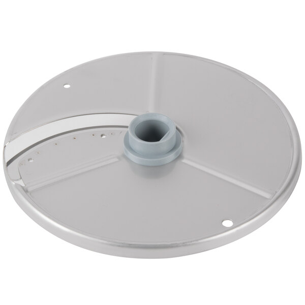 A silver circular metal Robot Coupe slicing disc with a hole in the center.