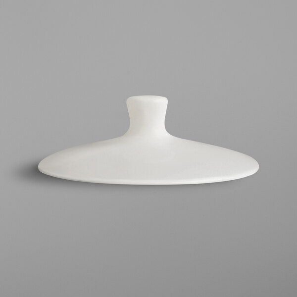 A white RAK Porcelain coffee pot lid with a round neck.