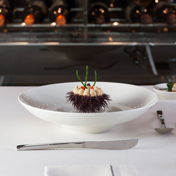 a sea urchin with white cream and red caviar