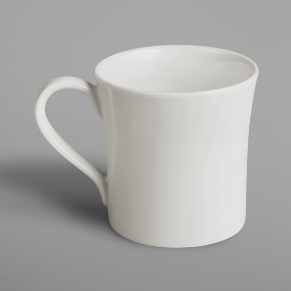 A white RAK Porcelain mug with a handle.