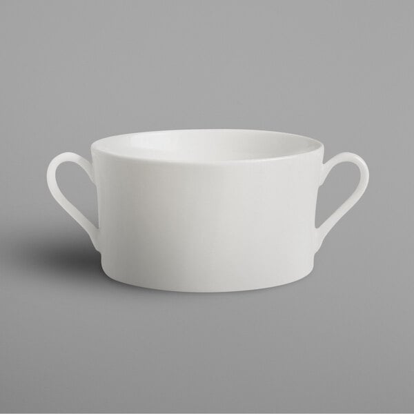 a white curved object with a grey background