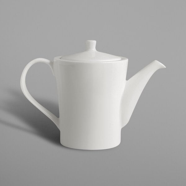 A white RAK Porcelain coffee pot with a lid and handle.