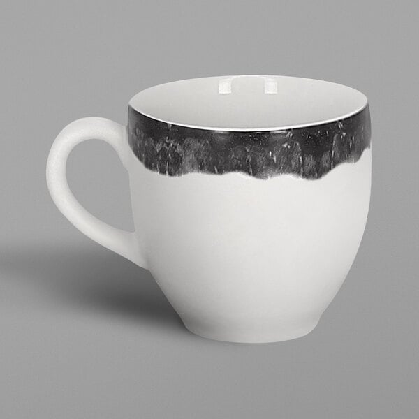 A white porcelain espresso cup with a beech grey rim and handle.