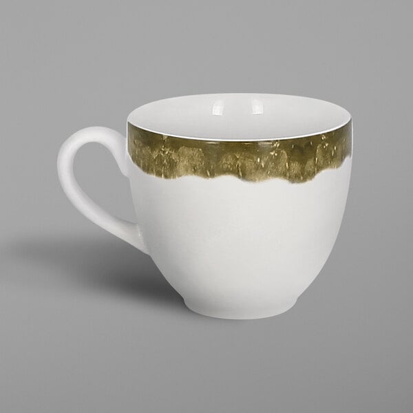 a white and gold coffee cup